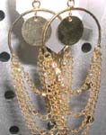 Open circle shape fish hook earring motif gold circle chip in middle with multi chain fringe design 