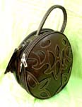 Wholesale accessory wear outsoucing distributor. Womens imitation leather handbag with decorative stitched design, zippered pocket and handle