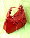 Best buy wholesale accessory shopping warehouse. fashionable red evening purse in faux leather with bow tie on front and long shoulder strap