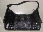 China handbag factory import wholesaler supplies Black imitation leather handbag with zipper for large center pocket, floral design in center strip of double crisscross pattern, and short shoulder strap