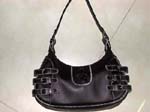 Shop wholesale at lady fashion purse factory. Classic black imitation leather handbag has three stylish buckles along side and a white stitched border around entire purse