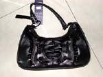 Shop import wholesale distributors for womens apparel wear and purses. Fashion replica leather, black purse has braided cord woven throughoutand pleated oval decoration on front