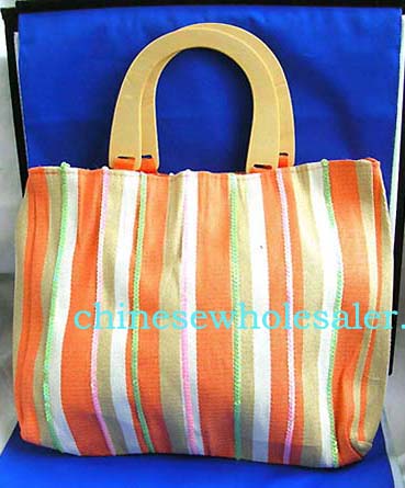 Discount designer handbag wholesale gifts. Fabric orange wooden handle hand bag with orange, white and nature color line section and yellow sparkle chips thread work design, also inside zipper pocket, cell phone pocket and zipper closure   


   