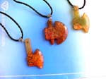 China exported crafted jade jewelry sold wholesale. Twisted black cord necklace with genuine chinese brown / yellow jade hammer or tomahawk pendant