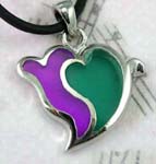 Fine wholesale necklace jewelry import and distributed. Black cord fashion necklace with purple and green double hearted pendant