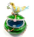 Enamel green jewelry box motif bird figure standed on tree stick holing a cz cherry in a mouth with enamel in gold and blue color