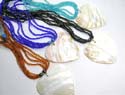 Assorted multi bead strings necklace with a heart shape seashell pendant