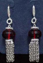 Online jewelry wholesale supplying women fashion earring. Simulated ruby stone between rhodium chains dangling bellow and fashionable circle pattern that connects to stud.