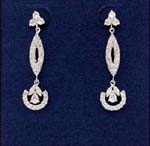 Wholesale rhinestone jewelry store exports quality fashions for her. Three gemmed studs holding cz stones embedded into cats eye shaped chain with flower figures attached to cz inlaid houseshoe design