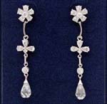 Wholesale fashion supply distributors selling cz jewelry. Floral designed earings with cz stones in flower of stud and in the leaves that lead to larger cz tear drop chrystal. 