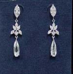 Fine cz earring supplier distributes wholesale jewelry online. Cz stones form the oval shaped studs and tear drop hanging below which is connected by a rhodium plated butterfly design