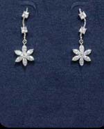 Designer inspired wholesale jewelry products imported by China business agent. Fashionable earings have curvy poles with two cz stones attached and a rhodium plated flower dangling beneath