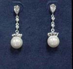 Wholesale supplier manufacturers and sells gemstone earring for her. Imitation pearl dangles beneath rhodium plated chain with two cz stones and oval cz chrystal in stud.