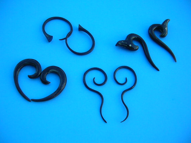 Beautiful organic artisan made wooden horn earring. B2B trade distributor