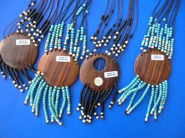 Balinese jewellery distribution - Round wooden pendant with mini beaded string hanging bellow and beaded necklace