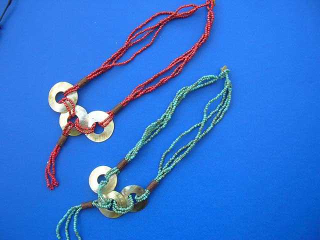 Organic gift wear distributor - Triple sea shell circle pendant charms entwined in multi string bead necklace 