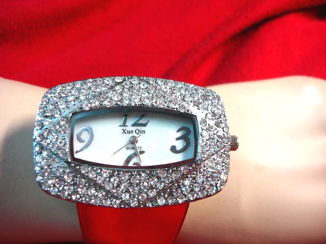 Ladies gift jewelry supplier - Rectangular shaped, large frame wrist watch with imitation diamonds and red strap