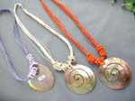 Fun multi colored string necklace with large circle seashell pendant in spiral design  from online wholesale supply company