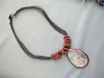 Beach bali gift warehouse importer, Translucent seashell pendant in raindrop design with coiled beads on multi string necklace 