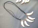 Indonesian summer fashion express wholesaler distributes Animal talon sculpted seashell charms on black cord necklace with wooden beads 